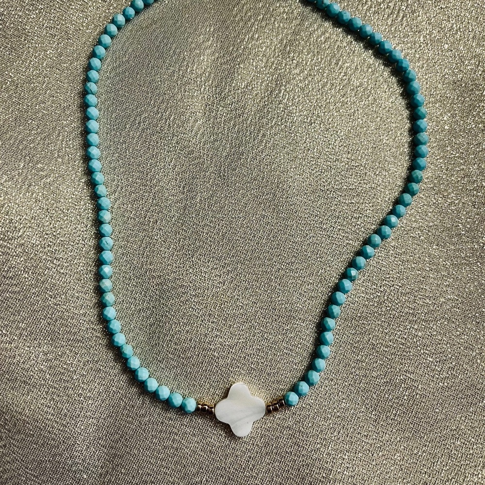 Dainty Turquoise Angel, Mother of Pearl, Golden Hematite. Gold filled clasp.